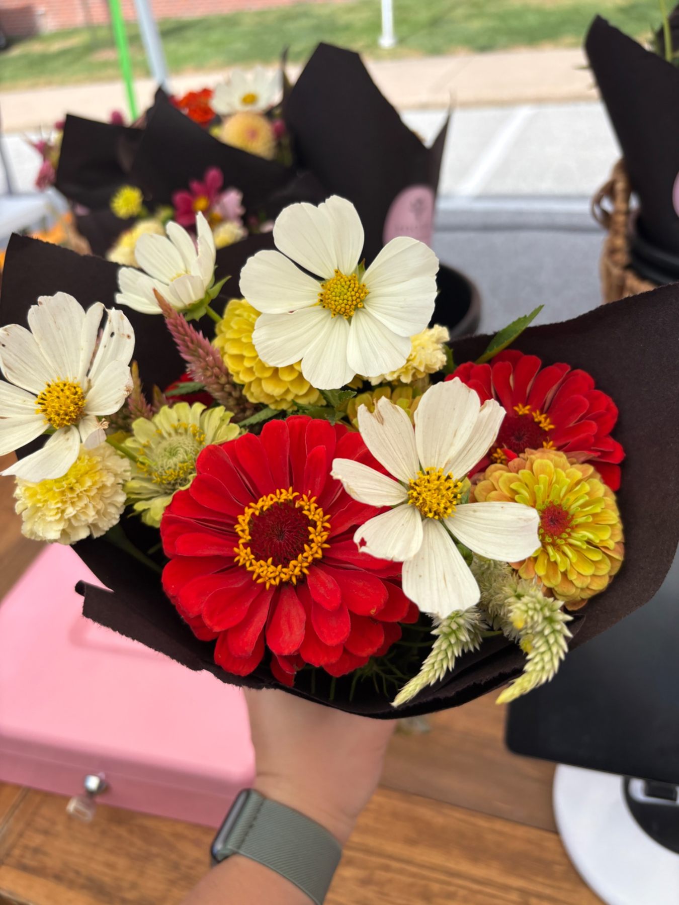 Bright bouquet of yellow and pink flowers at our market